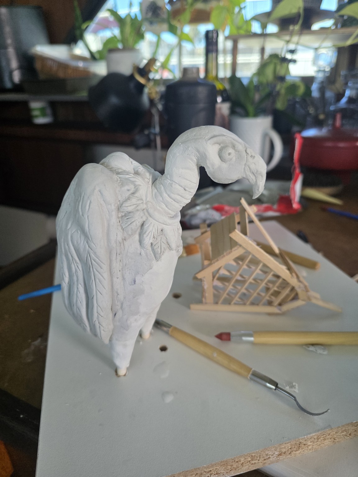 Clay vulture and wooden model made by Stone Larkin
